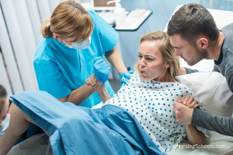 Advanced Practice Registered Nurse (APRN) working in a labor and delivery as part of her job duties..