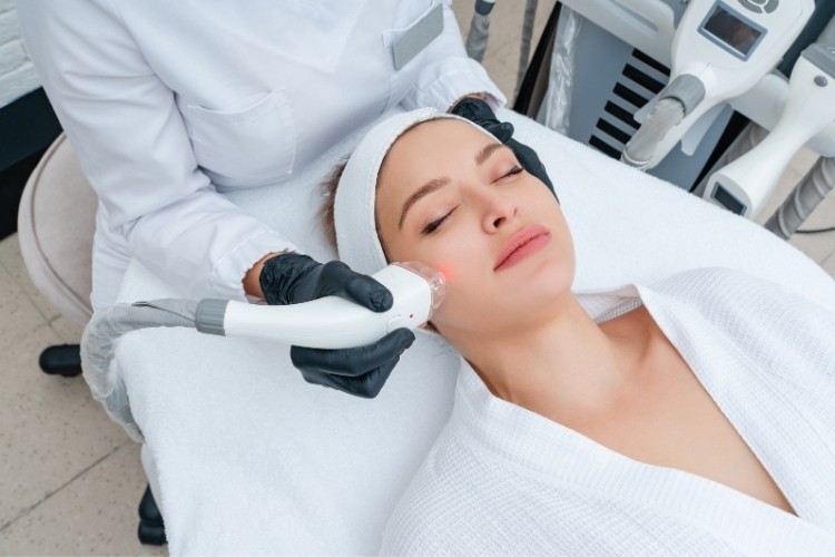 Cosmetic Nurse performing a laser skin treatment, applying assessment skills and staying current with evolving aesthetic technology.
