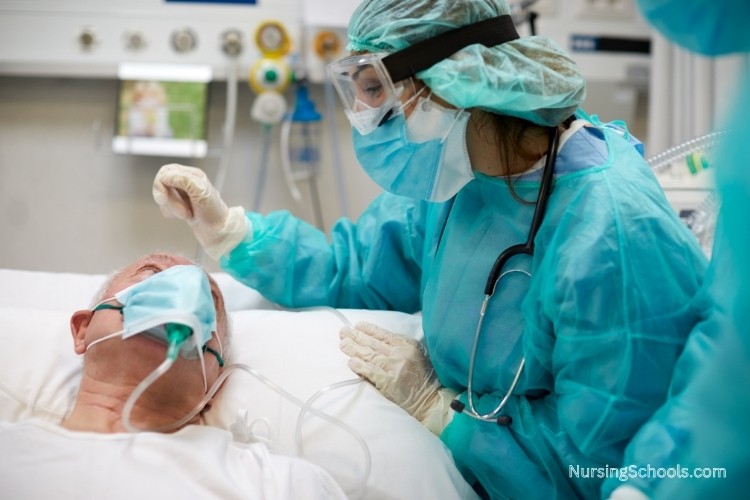 Critical Care Nurse delivering oxygen therapy to a patient experiencing respiratory distress.
