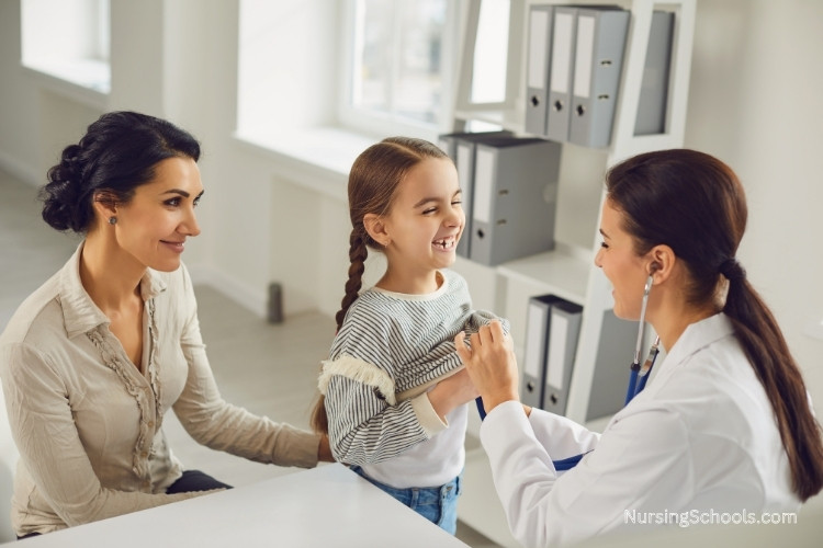 Genetics Nurse examines a young girl with her mom at a clinic.