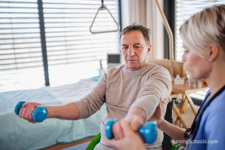 Holistic Nurse helping a patient with physical therapy in his hospital room.