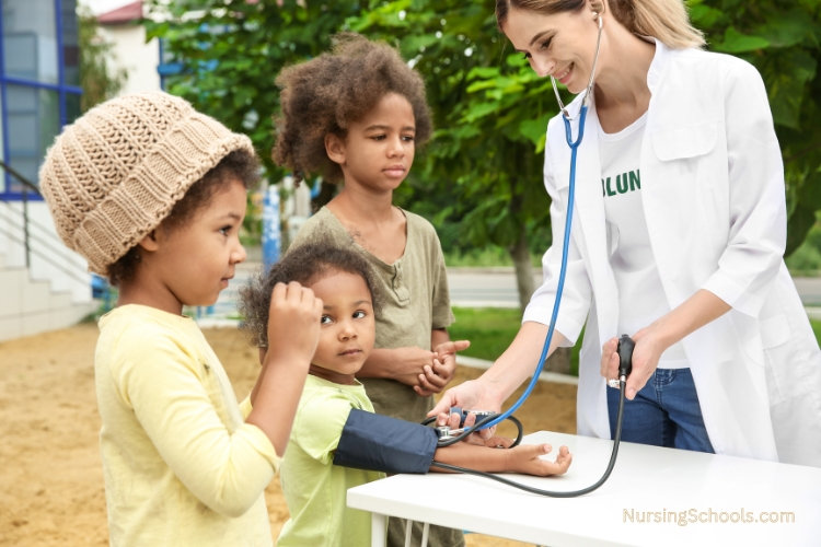 Missionary Nurse providing care to three children.