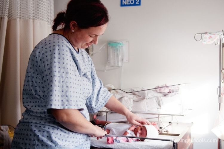 Neonatal Care Nurse teaches a mother how to care for her premature baby at a hospital.