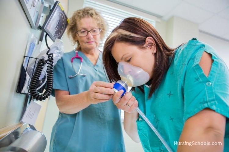 Nurse Anesthetist administers anesthesia to a patient for labor pain relief.
