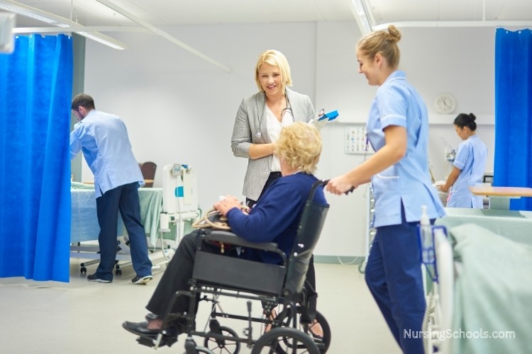 Nurse Manager speaks with a patient during discharge ensuring that care has met expectations.