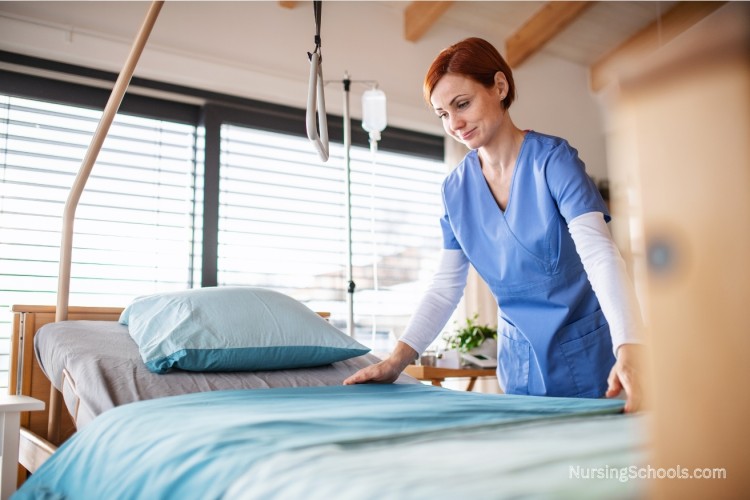 Nurse Technician cleaning a bed and hospital room.