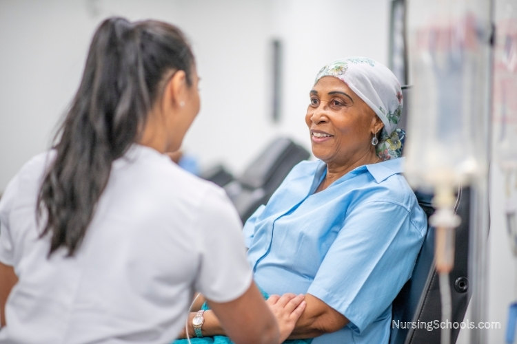 Pain Management Nurse talks to a cancer patient undergoing treatment in a hospital.