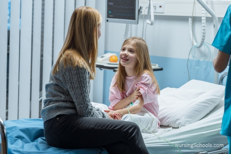 Pediatric Endocrinology Nurse cares for a child patient in a hospital bed.