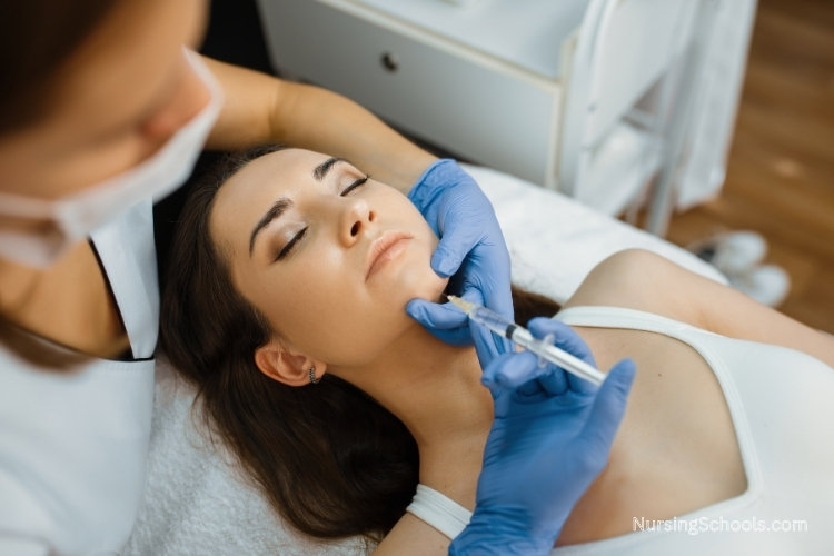 Plastic Surgery Nurse administers a botox injection to a patient's chin.