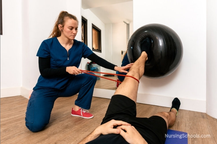 Rehabilitation Nurse works with a male patient at a therapy clinic.