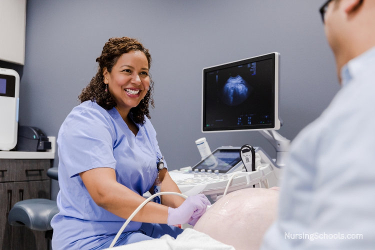 Reproductive Nurse assists with an ultrasound during early pregnancy care.