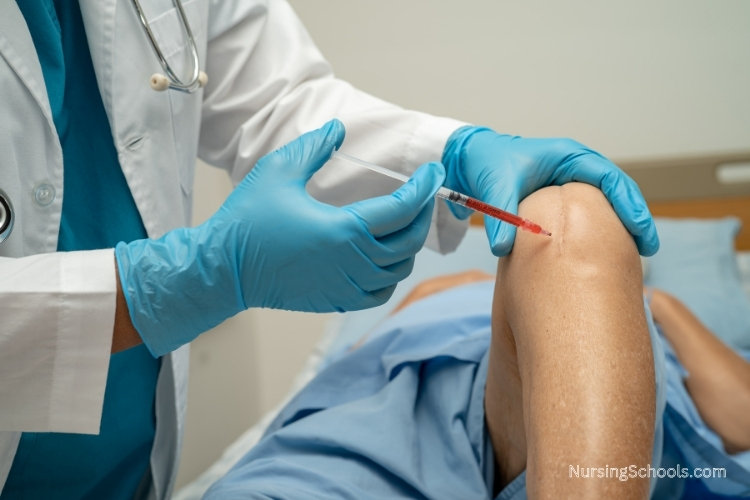 Rheumatology Nurse injects medication into the knee of a patient.